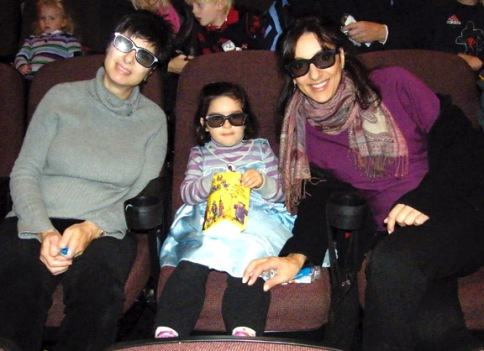 Niece, mother and aunt wearing 3D glasses before Tangled