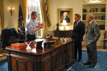 In this handout picture, from left to right, former Vice President Al Gore explains to 'West Wing' cast members Martin Sheen, who portrays the president on the show, and John Spencer that he doesn't want to leave the Oval Office set in a videotaped piece for the Saturday Night Live comedy show broadcast Saturday, Dec. 14, 2002. Photo by Justin Lubin