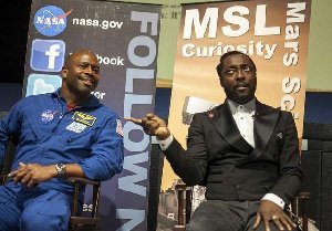 Musician Will.i.am of The Black Eyed Peas, right, and former NASA astronaut Leland Melvin, left, address bloggers at NASA Social media event at the Jet Propulsion Laboratory in Pasadena, Calif