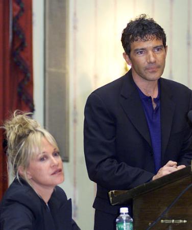 Antonio Banderas, right, talks to the media as his wife, actress Melanie Griffith, left, looks on prior to an unveiling of a statue of late actor Anthony Quinn as 'Zorba the Greek,' at the Biltmore Hotel in Providence, R.I. Photo by Victoria Arocho