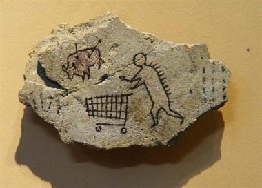 This image released by the British Museum on Thursday May 19, 2005 shows a hoax cave painting of a primitive man pushing a supermarket trolley which was on display in the British Museum in London. The work was planted by an anonymous 'art terrorist' called Banksy and museum staff were alerted Wednesday May 18, 2005, after he put a message on his website, saying that the 10in by 6in rock, 'had remained in the collection for quite some time'. This is not the first time Banksy has stuck fake objects to gallery walls and waited to see how long it takes before curators notice.