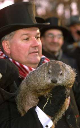 Official Groundhog Handler Bill Deeley holds Punxsutawney Phil during the 116th Groundhog Day celebration. Photo by Jason Cohn