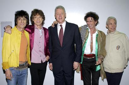 Former President Bill Clinton, center, joins the Rolling Stones joins the Rolling Stones from left, Ron Wood, Mick Jagger, Keith Richards, and Charlie Watts at the Staples Center, Thursday, Feb. 6, 2003 where the Stones turned a free concert into an effort to raise awareness about global warming. The event was organized by the Natural Resources Defense Council, a nonprofit activist group. Photo by Lester Cohen