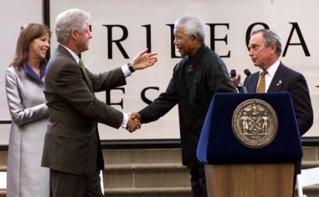 Nelson Mandela (C) greets Bill Clinton as New York Mayor Michael Bloomberg (R) looks on with producer Jane Rosenthall (L) at the First Annual Tribeca Film Festival. Photo by Mike Segar