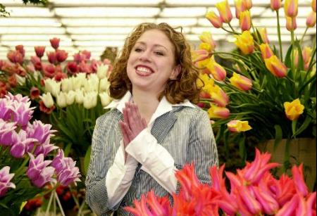 Chelsea Clinton smiles amongst her favorite flowers, tulips, at the annual Chelsea Flower Show in London, Monday May 20, 2002. Photo by Toby Melville