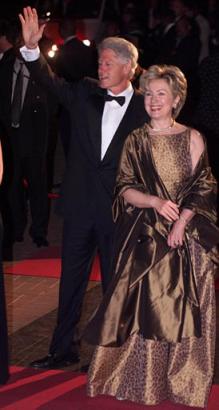 Former U.S. President Bill Clinton waves to the crowd as he arrives with his wife, Hillary at Nelson Mandela's star studded 85th birthday party celebration in Johannesburg, South Africa, Saturday July 19, 2003. Photo by Obed Zilwa