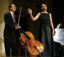 Yo-Yo Ma & Condoleezza Rice,  hold hands. Photo by Pablo Martinez Monsivais