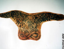 The dead father's eagle tattoo taken from his back