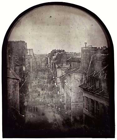 A handout of one of two daguerreotypes (images on metal plates) showing the rue St Maur in Paris before and after the attack on the barricades by General Lamoriciere's troops during the revolts of June 25 and 26 1848. The photographs, taken by pioneering French photographer Thibault, are the earliest recorded example of photo-reportage and are due to be auctioned at Sotheby's in London on Thursday, May 9, 2002.