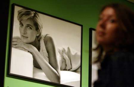 A visitor to the Mario Testino exhibition stands in front of a portrait of Britain's Princess Diana. Photo by Dan Chung
