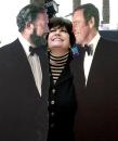 Joanne Worley clowns with cardboard cutouts of show's stars Dan Rowan, left, and Dick Martin