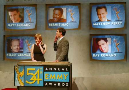 Actress Laura Innes (L) of the series ''ER'' and Eric McCormack of ''Will & Grace'' reveal the nominees for Best Lead Actor in a Comedy series as Emmy nominations are announced July 18, 2002 in Los Angeles. McCormack reacts as he realizes he is not among the nominees. The Emmy Awards will be presented in Los Angeles September 22. Photo by Fred Prouser
