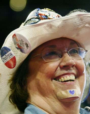 Texas delegate Pat Peale wears a bandaid with a purple heart on it on her chin during the first day of the Republican National Convention in New York August 30, 2004. Democrats and Democratic National Committee Chairman Terry McAulliffe reacted angrily after seeing Peale on national television appearing to mock the Purple Heart ribbons awarded to Democratic presidential nominee Senator John Kerry in Vietnam. Peale was quoted as saying she had gotten a purple heart earlier in the day 'swimming a river I think it was.' Photo by Robert Galbraith