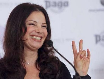 US actress Fran Drescher gestures as she answers journalists questions