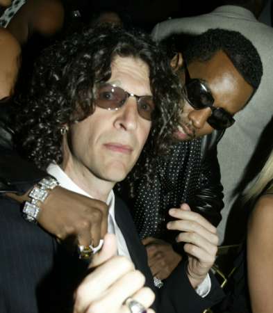 Singer Sean'P Diddy' Combs poses with talk show host Howard Stern L