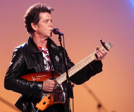 Lou Reed performs during the ''Pavarotti and Friends 2002'' charity concert in Modena, northern Italy, Tuesday, May 28, 2002. Italian opera star Pavarotti organized 
a concert with international singers in his private estate in northern Italy. Proceeds will go to the United Nations High Commissioner for Refugees for medical, 
educational and water facilities to benefit almost 80,000 Angolans in refugee camps in Zambia. Photo by Luigi Vasini