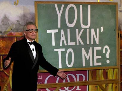 Director Martin Scorsese acknowledges the proper grammar of Robert DeNiro's famous line in the movie 'Taxi Driver', which he directed, during a skit as he is honored by the Hasty Pudding Theatricals as their Man of the Year at Harvard University in Cambridge, Mass., Thursday, Feb. 13, 2003. Photo by Charles Krupa