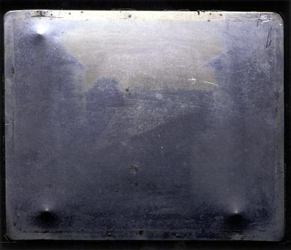 This photo shows a fresh portrait of the 1826 image, widely acknowledged as the world's earliest photograph, that was unveiled Friday, Nov. 21, 2003, during an Austin, Texas, symposium celebrating the life and work of pioneer photographer Joseph Nicephore Niepce. Along with the new, unmanipulated reproduction, scientists are presenting the results of an unprecedented checkup on the condition of the 8-inch-by-6.5-inch image, which shows the view from a window of Niepce's family home.