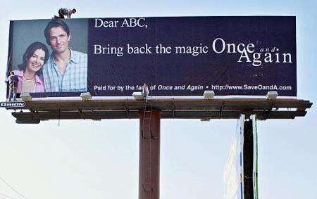 Workers put up a billboard in West Hollywood, Calif., asking the ABC network to 'Bring back the magic, Once and Again.' Photo by Nick Ut