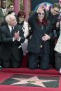 Honorary Mayor of Hollywood Johnny Grant, left, Ozzy, Sharon, and Jack, right. Photo by Nick Ut