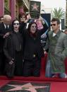 Ozzy, Sharon, Kelly, Jack, Marilyn Manson, 2nd left, and Robbie Williams, right. Photo by Nick Ut