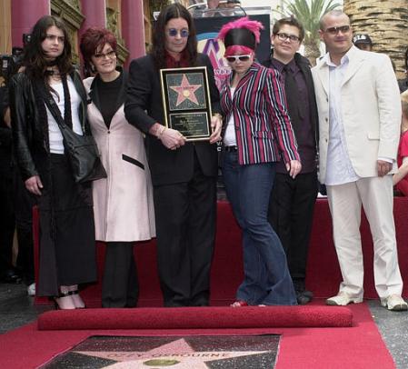 Ozzy Osbourne, center, poses with his family after he was honored with a star on the Hollywood Walk of Fame Friday, April 12, 2002. At far left is Osbourne's older daughter Aimee, his wife, Sharon, second left, Kelly, 17, third from right, and Jack, 16, second right, and his son Louis, from a previous marriage, is at far right. Photo by Nick Ut
