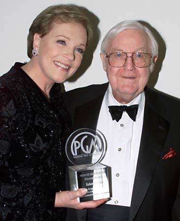 Producer/director Robert Wise poses with Dame Julie Andrews and the Milestone Award he received at the Producer's Guild Awards March 3, 2002 in Los Angeles. Photo by Fred Prouser