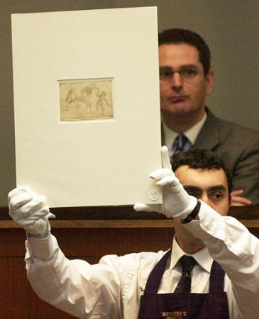Sotheby employee holds an heliogravure representing a horse and a child from 1825 by Joseph Nicephore Niepce, the earliest recorded image created by photographic means, Thursday March 21, 2002 in Paris. Photo by Francois Mori