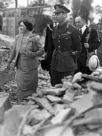 The Queen Mother, with her husband King George VI tours bombed areas during WWII in this 1940 file photo