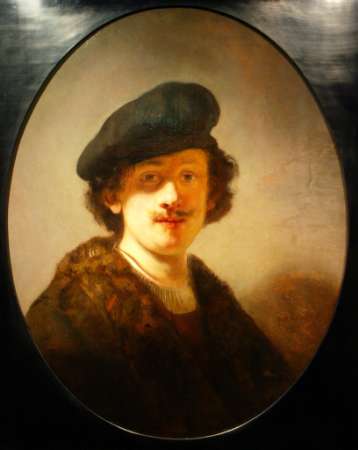 This portrait showing a 28-year-old Rembrandt with long hair, moustache and a beret was discovered by a team of art specialists led by Rembrandt expert Ernst van de Wetering, who examined the mystery canvas in forensic detail in the 1990s. The Rembrandt self-portrait, hidden for centuries after it was painted over by another artist, was displayed for the first time at the Rembrandt museum after years of painstaking restoration in Amsterdam, January 30, 2003. Photo by Paul Vreeker
