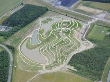 This is an undated image release by the Banks Group of a rock and earth sculpture in Northumberland northern England. Britain's Princess Anne unveiled Monday Sept. 3, 2012 a giant goddess sculpted from rock, earth and waste reclining in the remains of a coal mine in northern England. The private ceremony will formally declare that the 1,300 foot (400 meter) long figure, named Northumberlandia, has been completed. The female figure, also known as 