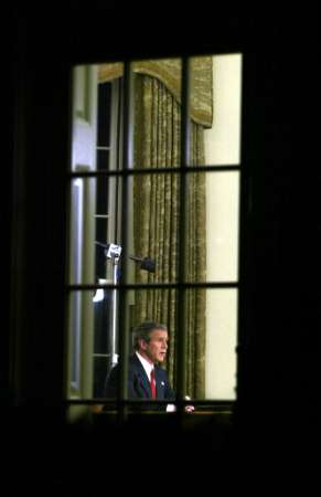 resident George W. Bush announces the start of a war against Iraq from the Oval Office of the White House March 19, 2003. The U.S. said it had begun its war against Iraq just minutes after several explosions were heard over Baghdad.  Photo by Kevin Lamarque