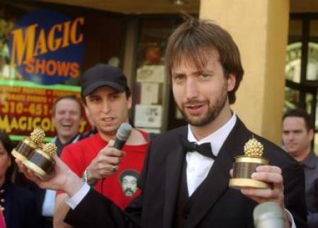 Tom Green holds three of the five Razzies that he won. Photo by John Hayes