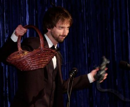 Tom Green holds a basket full of Razzies. Photo by John Hayes