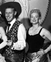 In this undated photo provided by Disney, Wally Boag and Betty Taylor, in their roles as Pecos Bill and his sweetheart Slue Foot Sue in the long-running Disneyland show 'The Golden Horseshoe Revue,' are shown. They shared a stage at Disneyland in Anaheim, Calif., for five days a week for nearly three decades and died within a day of each other. Taylor passed away Saturday, June 4, at her home in Washington state, one day after the death of Boag, 90, of Santa Monica, Calif., on June 3.