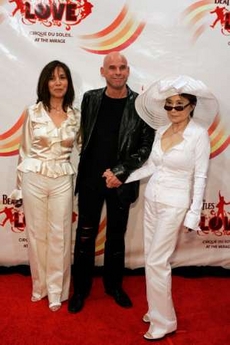 Olivia Harrison (L), wife of the late George Harrison, Guy Laliberte (C), Cirque du Soleil founder, and Yoko Ono, wife of the late John Lennon, arrive for the gala premiere of 'The Beatles LOVE by Cirque du Soleil' at the Mirage hotel and casino in Las Vegas, Nevada, June 30, 2006. Photo by Steve Marcus