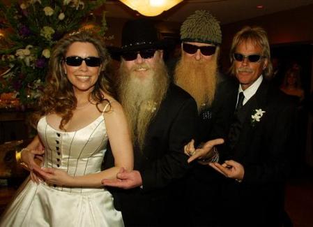 Charleen 'Chuck' McCrory stands with her husband, ZZ Top bassist Dusty Hill. Also shown are the band's guitarist Billy F Gibbons, background left, and drummer Frank Beard. Photo by Richard Carson